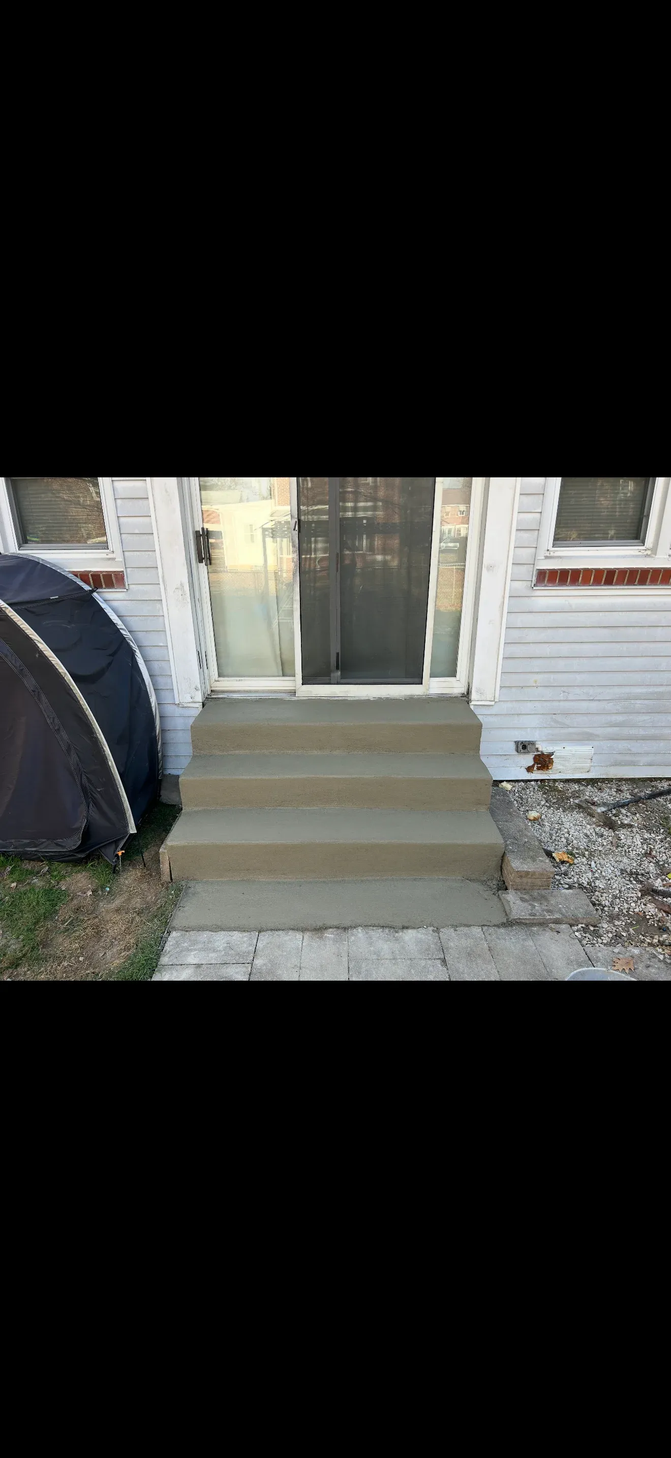 New concrete front stoop and steps to entry door, residential concrete repair by Zavala & Sons